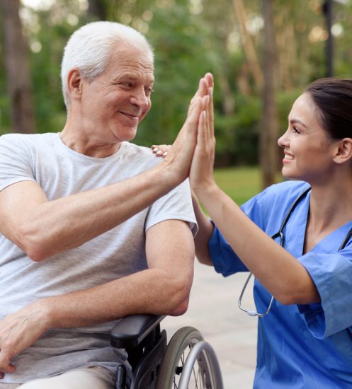 nurse-old-man-wheelchair-high-five